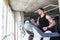 Side view portrait of young adult man in sportswear running on treadmill at gym. Handsome masculinity male training on treadmill