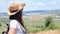 Side view portrait of young backpack woman in hat and sunglasses enjoying amazing natural landscape