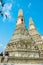 Side view of prangs of Wat Arun in Bangkok