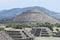 Side view of the pyramid of the sun with tourists ascending in the sacred place of Teotihuacan, 60 km from Mexico City