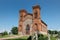 Side view of rectangular plan, two-tower church with Neo-Gothic features of the Romantic period fence stone masonry