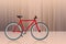 Side view red and black and white bicycle on motion and speed brown background, object, fashion, sport, relex, decor, copy space