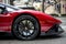 Side view of a red Lamborghini Aventador parked in Wilshire Boulevard
