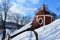 Side view on round rear part of middle church of baroque calvary in Banska Stiavnica, Slovakia, during winter season 2018