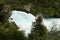 Side view of the rushing wild stream of Huka Falls near Lake Tau