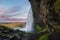 Side view of Seljalandsfoss Waterfall in Iceland.