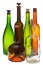 Side view of several empty closed wine bottles