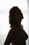 Side View Of Silhouette Semi Dressed Woman