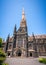 Side view of St Patrick`s Cathedral and spire a Roman Catholic Cathedral church in Melbourne Vic Australia