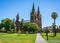 Side view of St. Peter`s Cathedral an Anglican cathedral church and Creswell Gardens green park in Adelaide SA Australia