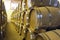 Side view of stacked casks at a whisky distillery in a row under the light