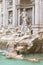 Side view of the statues of the Trevi Fountain in Rome