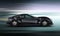 Side view of stylish black sports car with motion blur background