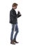 Side view of stylish man in biker style clothes getting dressed buttoning jackets sleeve.