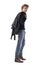 Side view of stylish walking redhead man carrying leather jacket over the shoulder.