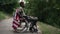 Side view thoughtful depressed African American young soldier in wheelchair with USA flag looking away thinking