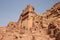 Side view of Tomb of Unayshu which has been cut into the sandstone cliff, Petra, Jordan, Middle East