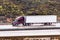 Side view of truck going uphill on the interstate on a rainy day, Los Angeles, California