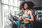 Side view of two attractive sports women on running track. Girls on treadmill