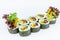 Side view of Vegetable Futomaki Sushi Roll isolated on white bakground. Maki roll with tomato, cucumber, avocado, paprika, bell pe