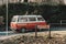 Side view of a Volkswagen Van with trees background