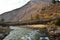 side view of walking suspension bridge with a lot of colorful prayer flags in Bhutan