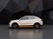 Side view of white self-driving electric SUV on black geometric background