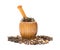 Side view wooden mortar and pestle with herbs on white background