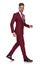 Side view of young businessman with parted lips walking