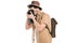 side view of young man with backpack photographing with camera