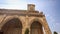 Side Wall Corner with Colonnade and Tower of Catholic Church