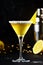 Sidecar, yellow cocktail with cognac, liqueur, lemon juice and ice. Black background, steel bar tools, copy space
