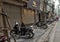 Sidewalk covered with parked motorcycles in Hanoi, Vietnam