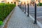 sidewalk, lined with gray paving stones