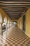 Sidewalk and old Mexican colonial archways in Valladolid, Yucatan Peninsula, Mexico