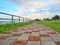 sidewalk with steel side rail, background