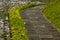 Sidewalk in street in Antigua Guatemala, natural light at dawn, outdoor concrete walk, public space.