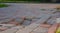 Sidewalk tiles and hole, damaged pavement, perspective view on the broken sidewalk tiles