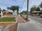 Sidewalk view of the street and shops on a cloudy day in the town of Crystal River, Florida