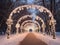 sidewalks in winter park with Christmas lights arch