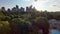 sideways aerial footage of a gorgeous summer landscape at Piedmont Park with the rippling waters of Lake Clara Meer