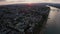 Sideways move of a drone showing the Dome with the Rhine river with cargo ships and reflections on the water and old bridge in