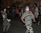 SIDMOUTH, DEVON, ENGLAND - AUGUST 10TH 2012: A dance troup dressed in very eerie black and white costumes take part in the night