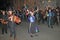 SIDMOUTH, DEVON, ENGLAND - AUGUST 10TH 2012: A group of musicians and clog dancers dressed in mauve and green and holding their