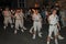 SIDMOUTH, DEVON, ENGLAND - AUGUST 10TH 2012: A troup of young lady Morris dancers hold their flaming torches as they takes part in