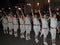 SIDMOUTH, DEVON, ENGLAND - AUGUST 10TH 2012: A troup of young lady Morris dancers hold their flaming torches high as they takes