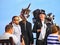 SIDMOUTH, DEVON, ENGLAND - AUGUST 5TH 2012: Three Morris dancers chat to passers by on the Esplanade