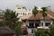 Siem Reap buildings panorama with tile roof top and palm trees. Rooftop view to cambodian city.