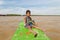 Siem Reap, Cambodia - January 31, 2017: Cambbodian poor boy sitting on old tourist boat in the river