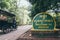 Siem Reap, Cambodia - June 2019: motorcycle rickshaw driving to Angkor Wat temple passing welcome sign